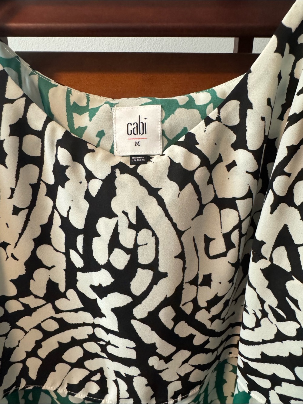 CAbi Black & White Floral camisole with Green Inner Print. Adjustable straps